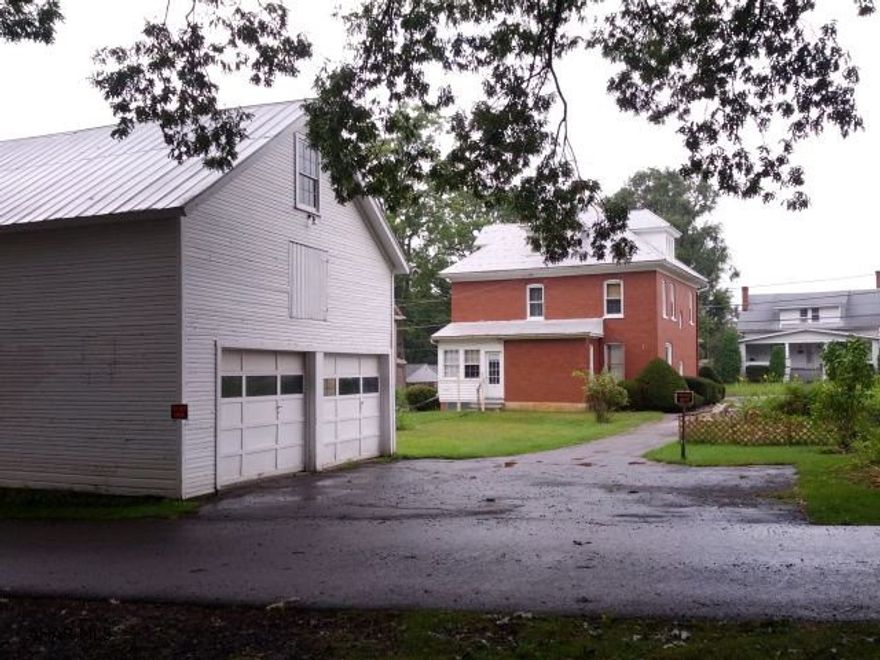 Nice, 2-story brick home with natural woodwork, modern kitchen, formal dining room, plus spacious 2-story, 2-car garage, blacktop drive.  Memorial Park across the rear alley.  J-210