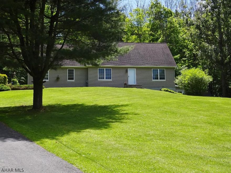 Beautifully maintained private and wooded. Oak cabinetry in kitchen, spacious rooms, 3.5 baths on 2.7 acres( 4 parcels). Absolutely beautiful sun room faces woodlands, see deer, turkey, bears, squirrels, Etc...