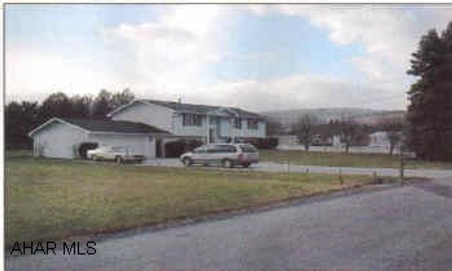 Beautiful split entry home in mint condition. Large .56 acre lot, landscaped, fenced and lighted, eat-in oak kitchen, 2 family rooms, 2+ car garage, enclosed breezeway.