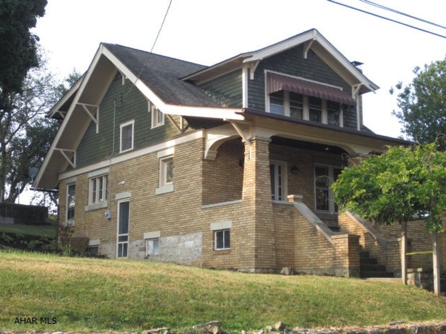 A very nice, solid, Craftsman style 2-story brick home with 3 bedrooms, 1.5 baths, fireplace, hardwood floors with oil fired hot water heat.  Has detached garage w/opener and a full size tennis court.  Owner open to reasonable offers.