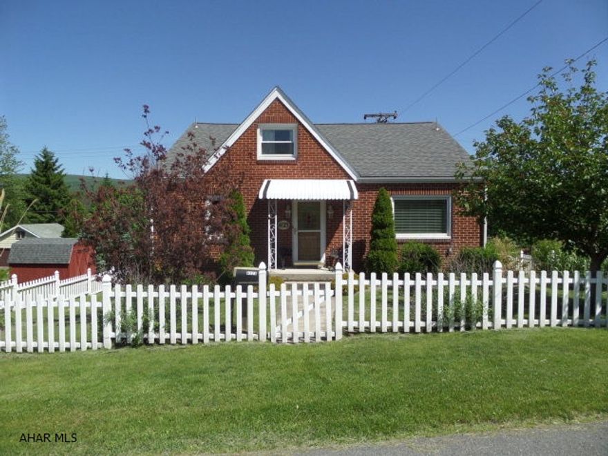 Beautifully updated brick, 4 bedroom cape cod on a corner double lot with a white picket fence on a quiet street.   Attractive kitchen with granite counter tops.  Newer furnace, windows, roof, C/A, hot tub, security system, carport, shed and gas fireplace.