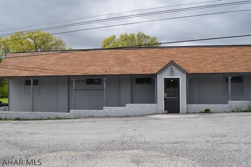 Former Restaurant/bar less than 1 mile from I99, 12 miles from Altoona & 29 miles from State College.  This large block building features 3096 square feet & is located on 2 parcels equaling 1.475 acres.  The interior delivers hardwood flooring in the entry & main dining area.  There are 3 bathrooms with tile flooring.  The bar & kitchen boast tile flooring.  Natural gas heat & central air.  Some commercial grade restaurant equipment including freezers & the exterior walk-in color are included (sold AS-IS).  Additional features include a metal roof, public water, 3 septic tanks, large paved parking lot & is Zoned Commercial Restaurant.  Excellent opportunity for those looking to open a new restaurant in a central & easily accessible location.  Property being Sold AS-IS.