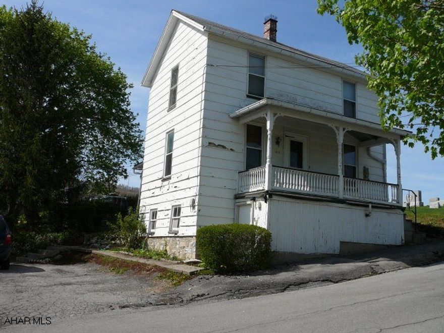 Covered front and rear porches.  Off street parking area.  First floor laundry and bath.