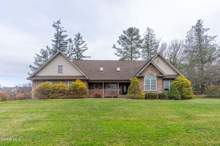 This Impressive Quality Built Stone Home on Sylvan Drive is close to everything yet far enough away to offer some peace and tranquility.  As you walk through the front door you will notice the open floor plan with cathedral ceiling that includes the kitchen with granite counter tops and backsplash, dining area and living room with gas fireplace.  Adjacent to the kitchen is a pantry and laundry room.  One the main floor you will also find a large Master Suite with walk in closet and private bath, 2 guest bedrooms and a guest bathroom.  The second level consists of a large Great Room, full bath and storage.  The basement has a full bathroom and can easily be finished.  
This home also offers an attached oversized 2 car garage with heated floor, concrete driveway, covered front porch and covered rear patio.