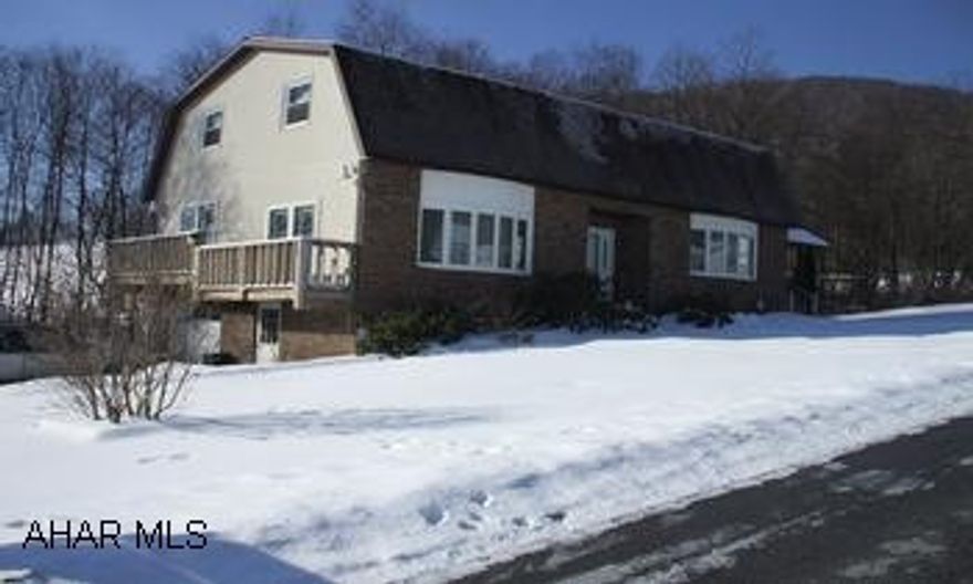 Lovely 2 story vinyl & brick 3 bedroom w/gambel roof. Blacktop driveway w/integral garage on .8634 acres. 2 story w/4x28 side deck & 10x22 covered deck. Eat-in kitchen, formal dining room, den, livingroom w/open foyer, 3 bedroom w/.75 bath, new carpet throughout, oak trim, oak cabinets, plenty of closet space.