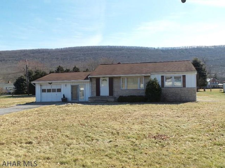 This ranch home needs TLC. Newly remodeled full bath, hardwood floors throughout home, spacious family room, full basement. Additional building lot included with this sale. Kitchen cabinets were refaced. This home is priced to sell. Public water & sewer, central air, gas forced air heat.