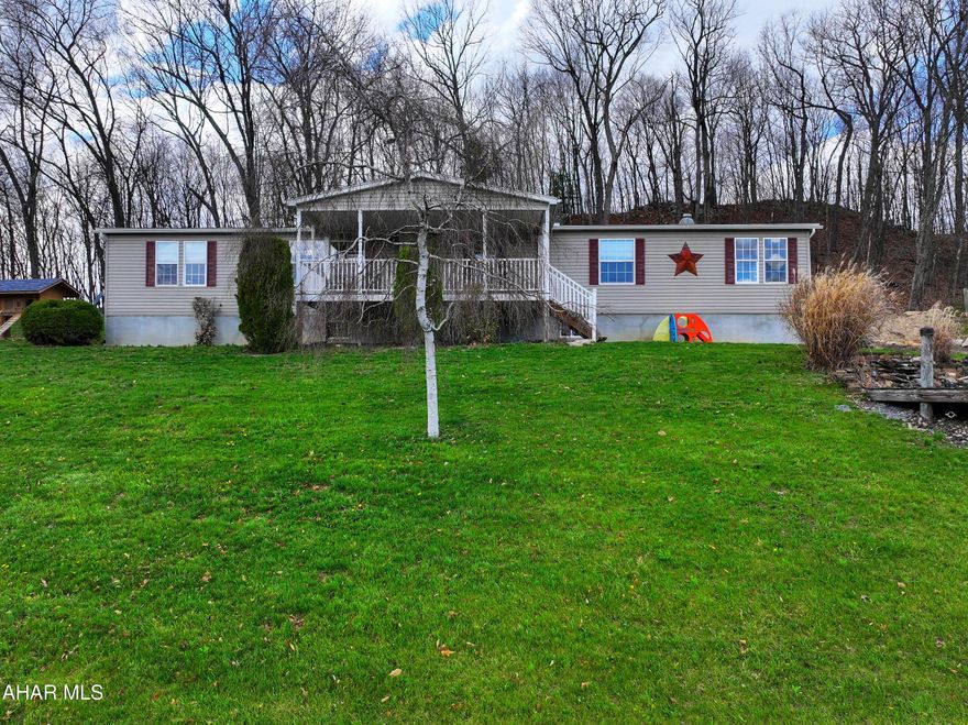 Spacious 2005 doublewide, 4 Bedroom, 2 Bathroom home situated on 4 beautiful acres in Northern Bedford School District. 

This home has so much to offer.  
A large kitchen with an island, walk in pantry, that is open to the dining area.

A living room and a large family.
Primary bedroom features a large 14'5'' x 4'9'' walk in closet and a private bath with double vanity, soaking tub, and a separate stand-up shower. 

Additional features include a convenient laundry room and a front porch that offers beautiful views.

The basement offers exceptional potential with plenty of additional space for storage, a workshop or future finished living area, along with a 2-car garage