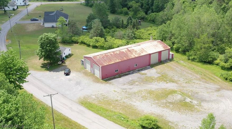 Looking for an office building and large warehouse to get your business started? This commercial property could be used in so many ways!  Previously Kitko Concrete, the warehouse is roughly 3,700 sq ft with a pit for heavy equipment repairs/maintenance. This property features approximately 4.58 acres so there is plenty of room to grow!