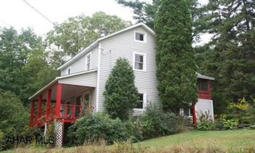 Secluded country home on 48 picturesque acres w/spring fed pond. Secluded country home on 48 picturesque acres w/spring fed pond. Barn and corn crib, rolling hills, wooded w/ approx 5 acres open fields. 2-story, vinyl house has country kitchen w/sitting area; large ristoc domomg / living room has wood stove and barnwood sided walls. 3 bedrooms and 2 full baths upstairs. Enjoy the quiet country setting from the upstairs screened porch, side porch, large covered porch that overlooks the pond and mountain, or deck. A great getaway! Sportsmans paradise.