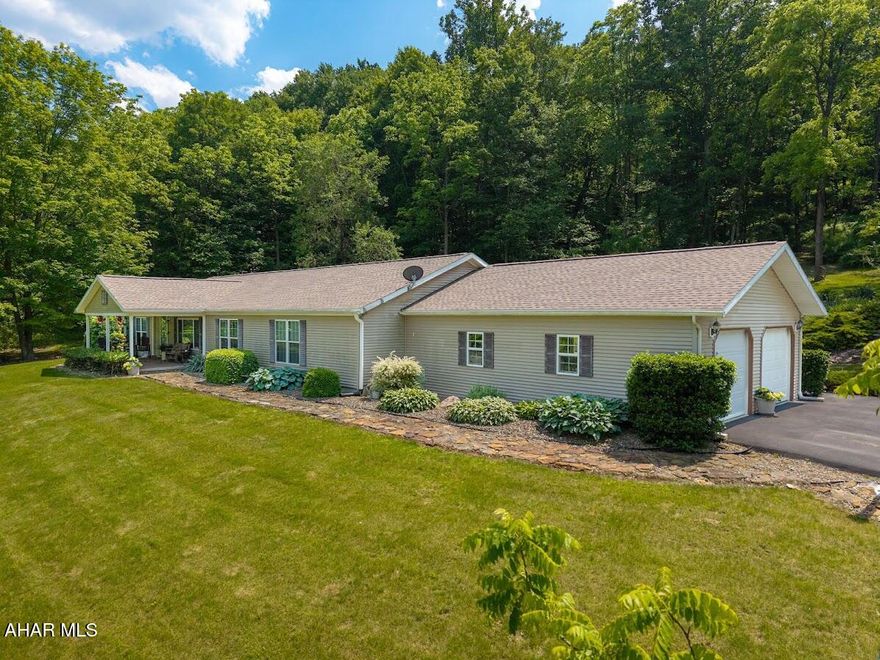 PLEASE REMOVE SHOES ON FT. PORCH BEFORE ENTERING.    BUYERS: ''RING'' & ''ALEXA'' devices present.   A well-maintained home on 6 acres just 13.5 mi. south of Bedford along peaceful Evitts Creek Rd.   Custom-ordered, quality, manufactured home w/ family rm. addition finished w/ yellow pine walls & cath. ceiling.  Oversized, att. garage. Extras:   6'' sidewalls, granite finishes in baths & kitchen; beautiful HW flrs. in kitch. & DR; den w/ ''French-style'' doors;  3 BRs; (primary suite w/ private bath & W-I closet); main-lev. laundry.
Buyer's responsible for verifying SF of GLA; acreage; prop. lines; county maps, taxes; internet & tv providers.