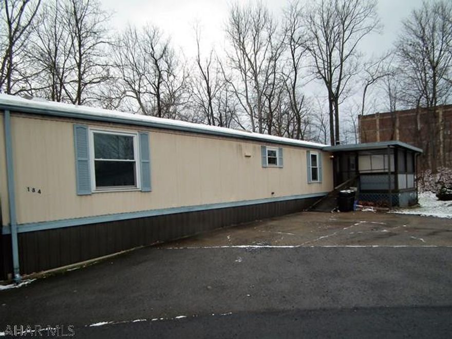 Great location in mobile area, nice location, private back yard (near creek), screened in porch, 3 bedrooms, 2 baths. Will need some TLC, seller is executor. If financing flood insurance will be required.  Lot rent includes sewer. This is a 55+ community.