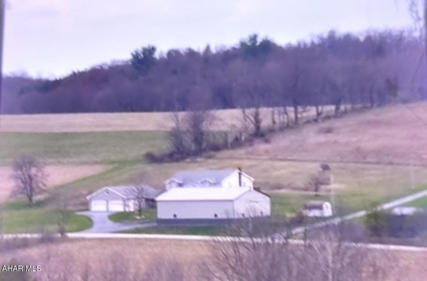 Vinyl & stone raised ranch home on 1.7 acres.  3 BR's & 2 baths on main level.  Finished lower level for additional living quarters.  32' x 40' attached garage & 40' x 60' detached garage that could store a motor home, backhoe, and many other toys or a great workshop.  Possibilities are endless.   A must see!