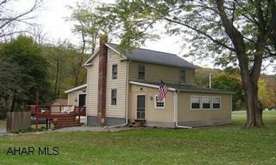 Improved 2-story vinyl colonial, 2BR/1BA on large lot, semi-private location. Newer roof, bath and water heater. 14x28 outbuilding, fenced.