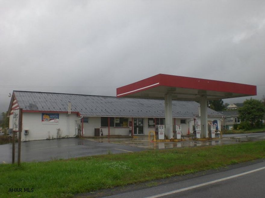 Previous convenience store/gas station in the Chestnut Ridge area.  Small fixed loading dock, advanced security system, & ample parking.  Almost 2 acres of land on State Highway allows for future expansion or development.  Full basement with integral garage/storage and space previously leased to a beauty shop.  Lots of equipment included in sale.  Terrific opportunity at this price!