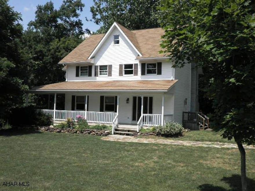 Lovely country setting 100 yards to S.G.L #48. Native stone landscaping. Overlooks bordering mountain stream from back deck and dining room bay window. Terrific floor plan w/ 2 stairways to the second floor (central foyer & kitchen back). Master bath w/ claw foot tub $ shower. Spacious Rooms!!