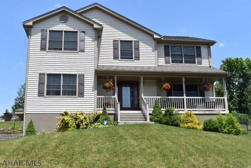 Well maintained home with a covered porch & inground pool.  Great for entertaining.