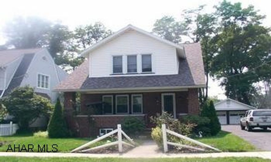 Immaculate Brick home in Columbia Park, new roof, windows, furnace, wiring, hot water tank, gas fireplace, Berber carpet, front and back porch, 2 car garage.