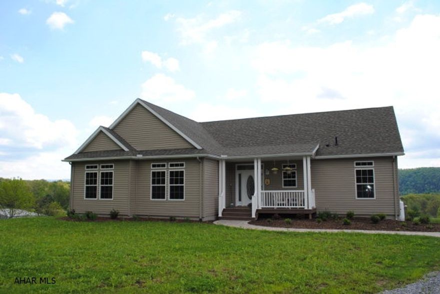 Open floor plan offers large foyer then great room w/stunning views of valley & ridges beyond. 8 1/2' ceilings. Transom windows throughout. Kitchen has lots of cabinets with creative angled layout, island & pantry. Ceiling has crown moulding & recessed lighting. Open room beyond kitchen has large window - can be family or breakfast room. Spacious MB & Bath at left side of home. Two bedrooms with walk in closet's and full bath on right side. 2nd story unfinished space is 12.5 x 60 with plumbing for bath. Basement w/ Superior walls w/insulation & double doors to back. Heat pump provides low utilities. Cozy front porch & impressive 10x30 composite deck at back. Plenty of land for gardens or pastures. 30 minutes to State College; 15 to Huntingdon & Lake.