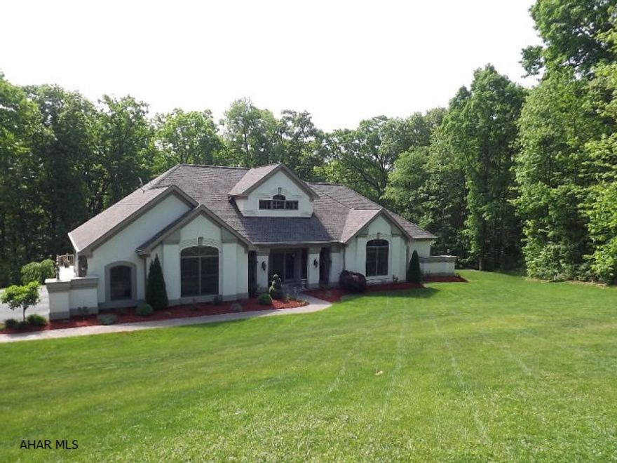 Spectacular energy-star certified builder's home situated on 1.49 wooded and private acres at the end of a cul-de-sac. Open concept in this split floor plan(2 master bedrooms) ranch with a full and finished lower level. Living areas on each floor capture the views from the 2-story wall of windows. Dining room boasts an open and airy 2 story ceiling. 34'x24' heated garage, combo and zoned heating. Solid oak throughout, 9' ceilings and open oak staircase to atrium.