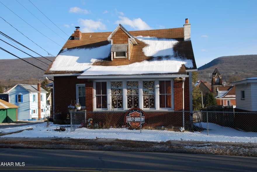 Set on a mostly fenced 50x120 lot, 329-331 E Walton Ave in Altoona offers 4 bedrooms and 1.5 baths with (approx. 1,443 sq ft) of living area plus a full basement (approx. 1,015 sq ft). Hardwood floors add warmth on the main level, and the lower level provides a large, open living area that works well for a media room, play space, or hobby area. Enjoy outdoor entertaining with a patio and outdoor bar and take advantage of a detached 1.5-car garage plus off-street parking space. Gas hot water heat is complemented by a wood burner for added comfort.