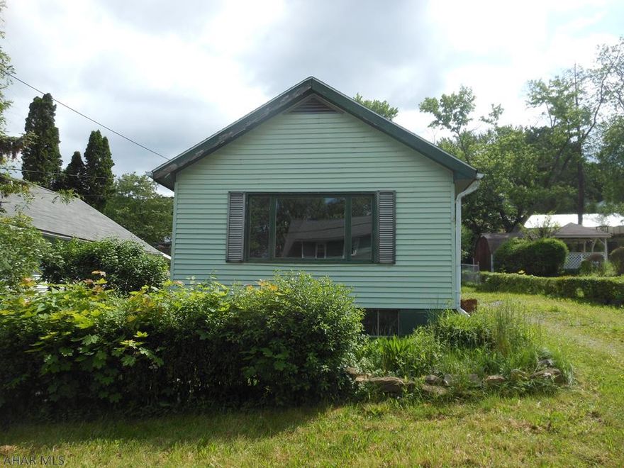 This is a Fannie Mae Homepath property.This is a two bedroom bungalow in Lakemont. Nice 50x120 lot with off street parking. Rear covered porch for relaxing and enjoyment of the yard. The main floor features a large family room, living room, dining room, kitchen and 3/4 bath. The kitchen has laundry hookups for you convenience. The basement is unfinished and could be finished for additional living space. With some custom touches, this house could be you home.