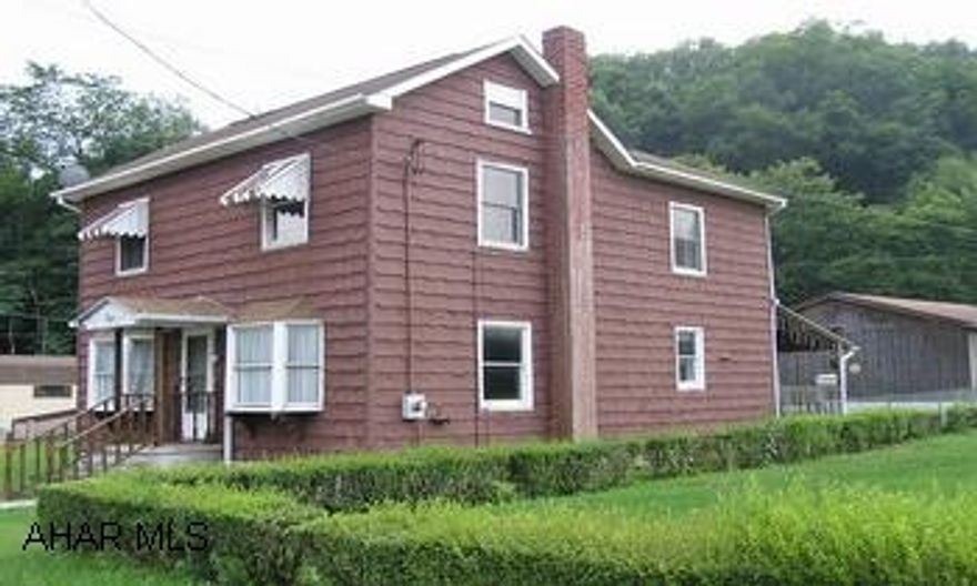 Handsome 2-story shingle styling 3BR/1BA  freaturing large Eat-in kitchen, huge living room and oversized 2-car insulated garage and workshop with electric and water. Covered wraparound deck, fenced yard, newer 200 amp service and oil HW furnace. 1st floor laundry.