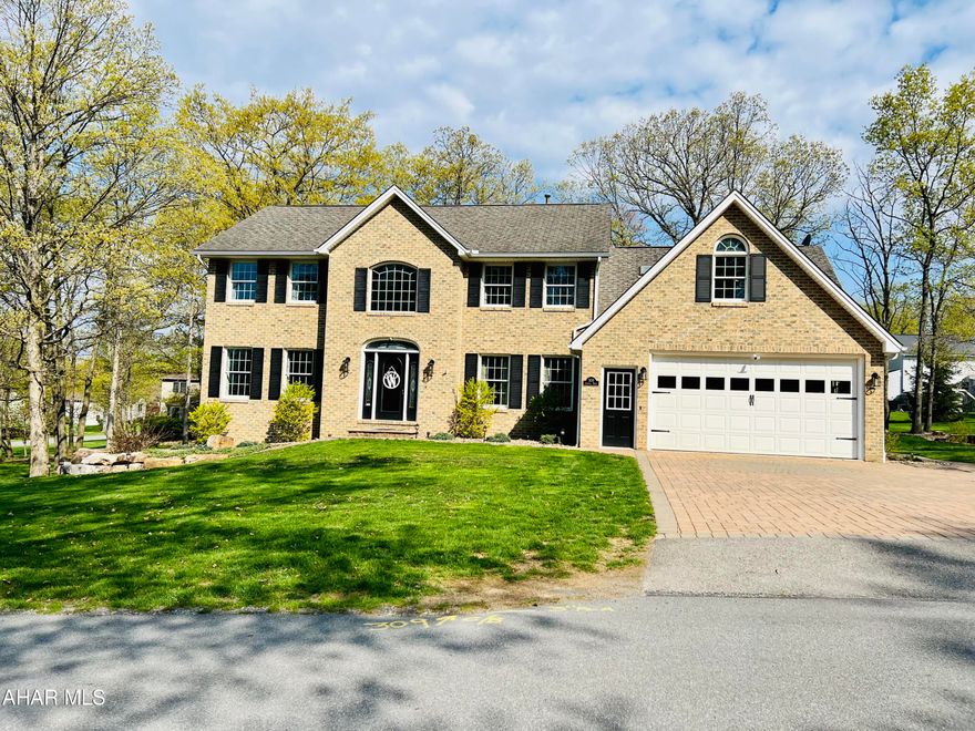 This two-story home is located in the picturesque Sylvan East Development in Hollidaysburg, PA, known for its serene and tranquil surroundings. The home boasts a spacious floor plan with over 4000 square feet of living space, providing ample room for comfortable living and entertaining.  The  heart of the home is the gourmet kitchen, which has been completely renovated to offer a perfect blend of functionality and style. The home features four bedrooms, including a luxurious master suite on the second level. The master suite boasts newer light fixtures,  walk-in closets, and a private en-suite bathroom with dual vanities, a jacuzzi tub, and a separate walk-in shower. The remaining three bedrooms are generously sized and offer ample closet space for storage. There are also three additional full bathrooms and a half bathroom throughout the home, all beautifully renovated with modern fixtures and finishes.  The basement family room is spacious, with a wet bar, a play room and a full bath.  There is plenty of storage in the bonus room.
Enjoy the nice weather on the two tiered composite deck or patio.