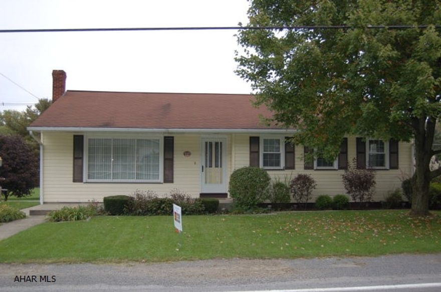 REDUCED PRICE--OWNER IS MOTIVATED TO SELL!  Beautifully maintained 3 BR home with large Florida room.  Back of home and Florida room overlooks Williamsburg Recreational Park.  House has newer carpet, newer windows, beautiful hardwood floors.  Two garages and a very usable basement.  This home is a Must See