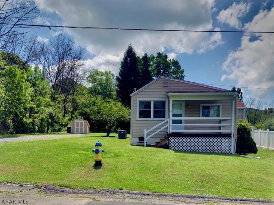 Oh My Oh My!!! The hardwood floors in this house are STUNNING! Very nicely updated and maintained ranch just outside of town.  2 bedrooms featuring a very big Master with a very large closet and an extra one just incase you need a little more storage room!  The 2nd Bedroom is a decent size room as well,  and has it's own walk-in closet. There are windows everywhere leaving in so much natural light. You will surely spend your evenings on the huge screened in patio because the view from it is Amazing. New furnace, HW tank, and C/A to top it off.  You will not have to do a thing but move in!