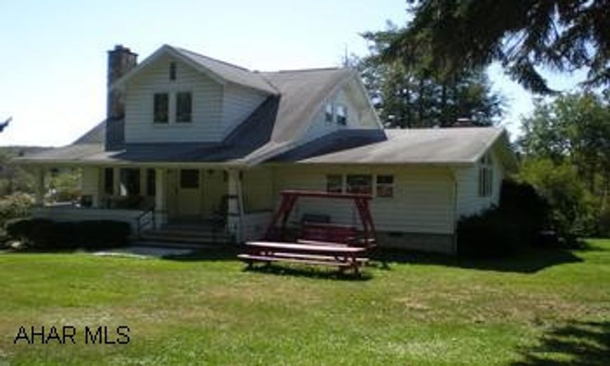 This home is used as a rental - copy of lease at office. Two story home with large family room addition. New septic system installed in 2007 is shared with the neighbor and on the neighbors property. From Cresson Lakes 100 yds toward Cresson on the Cresson Loretto Road. Currently used as a rental - call office for details.
