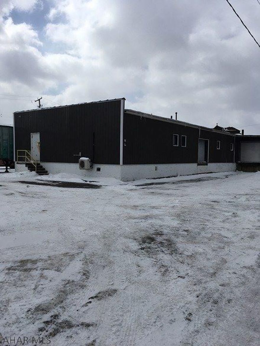 Warehouse in great location. There are 3 dock doors and 1 drive in area with 12ft door.  Could be subdivided by new owner.