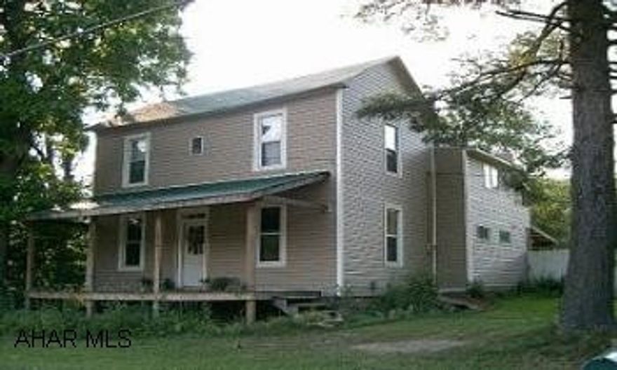 2 STORY HOME WITH 3 CAR GARAGE WITH WORKSHOP ABOVE, 8.3 ACRES OF GROUND, PAVILION. INCREDIBLE OPPORTUNITY.  2 STORY HOME, NEW FLOOR COVERINGS, FRONT AND REAR PORCHES, PAVILION, WORKSHOP, 8.3 ACRES, PUBLIC WATER AND SEWER, WOODBURNER.