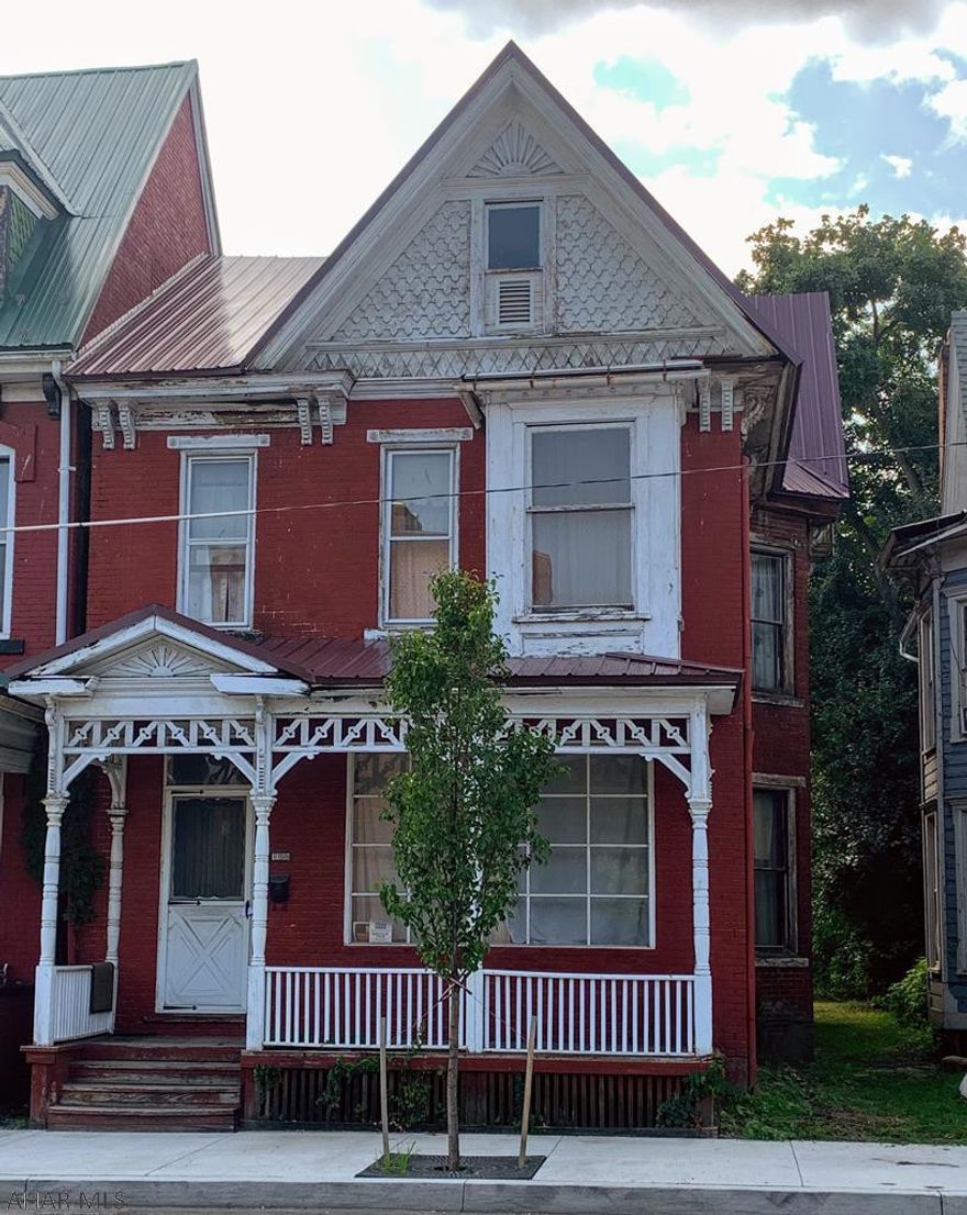 Investor or handy man special. Large 4-5 bedroom 2 bath home offers large rooms, hardwood floors, large eat in kitchen, fireplace, 2 car garage. Sold As Is. Motivated seller make offer