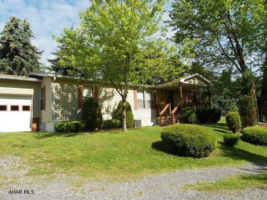 This is an older 1987 Doublewide on a crawlspace in Breezewood. Fenced side yard. Extra nice 2-bay garage. Three BR, 2 BA. This propertyis move in ready and priced to sell. Central air, newer roof, appliances includ3ed. Don't miss this one!