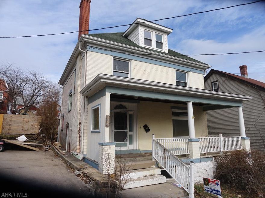 Spacious & large 4 Bed 1 Bath Brick, 1/2 Bath & Laundry on first floor.  Additional lot in rear of property included in sale.