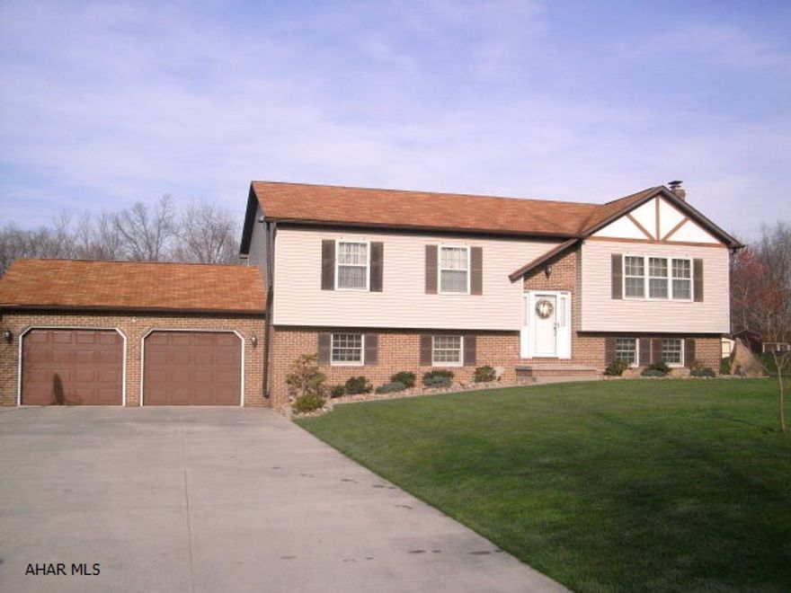 Beautiful home with four bedrooms, immaculate thoughout, family room with gas Fireplace, Gameroom with pellot stove, Laundry room with Bath, Large Storage Shed, Nice sized rooms. Beautiful lot, central air, Two car garage with full storage above. Covered deck with retractable awning.