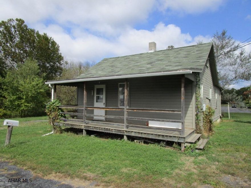 This property offers a level lot with public sewer. Close to town and all amenities. House needs a lot of work. Could be removed and new house placed on lot or foundation.