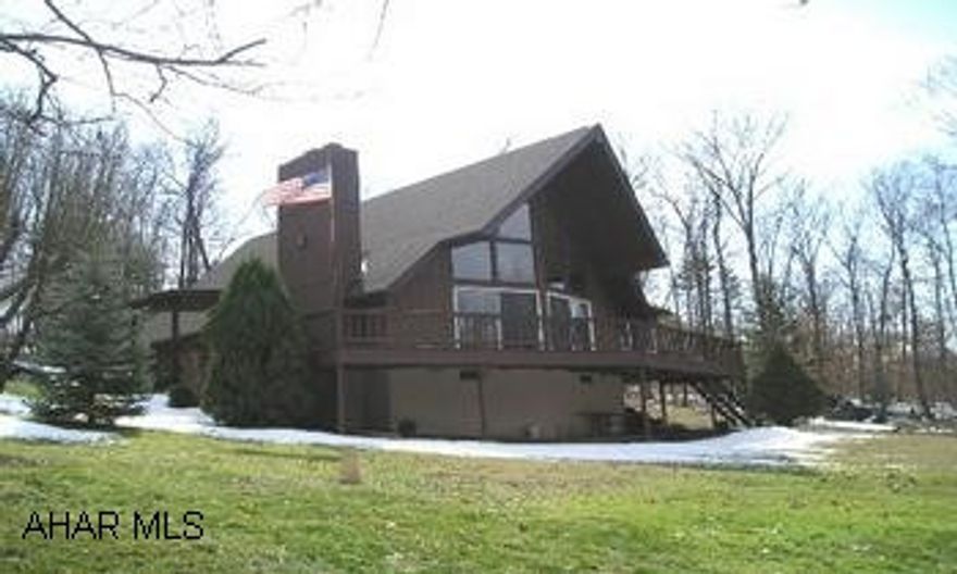 Elegant country contemporary on serene 10/+ wooded acres only 2.5 +/- miles from Cessna.  (Notation:  No drive-bys have been requested by the owners.  The agent accompanying the buyers is to please contact the listing agent/office for directions.) No sign.