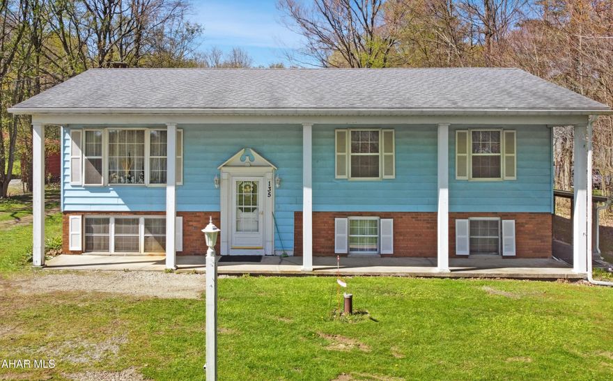 Welcome to 135 Mackinaw Street, located in the Central Cambria School District in Jackson Township. This stunning split-level home is situated on approximately 1.6 tranquil acres. The property boasts an oversized three-car detached garage, along w/ many exceptional features designed for comfort & convenience. The main floor welcomes you w/ a spacious living area, a charming dining room, & a large kitchen. You will find two well-appointed bedrooms & a luxurious master suite complete w/ a private full bathroom. Additionally, this home includes a convenient mother-in-law suite that features its own laundry hookups, a beautifully updated full bathroom, a kitchenette, & a versatile bedroom/living area. The lower level, while unfinished, presents opportunities for customization & cozy living, featuring a wood-burning fireplace, a newer oil forced air furnace, & ample storage space. Outside, the expansive 1.6 acres offer privacy & room to roam, complemented by a covered front porch perfect for relaxation or entertaining. Don't miss your chance to make it yours, call today for a private showing!