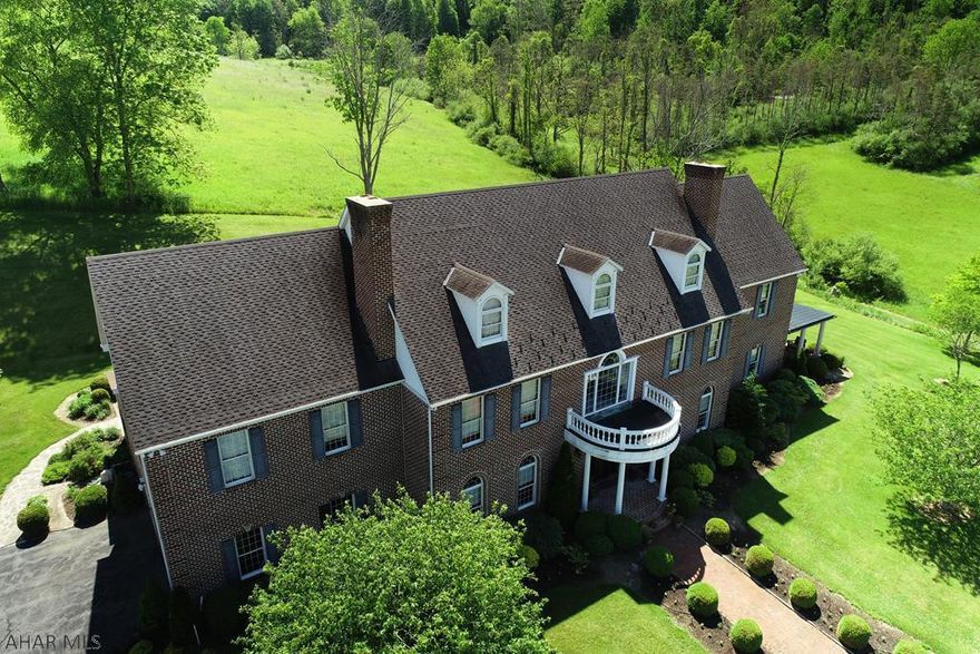 Enter your private oasis on 135+/- acres as you pass through the impressive electric brick gate that leads to the half mile paved driveway.  As you pass by the 3/4 acre, 10' stocked pond, the majestic brick energy efficient mansion awaits your arrival.  Vistas are impressive but the privacy and the absolute peace and solitude is awe inspiring when you reach this perfectly positioned home nestled in the Alleghany Mountains. No detail was overlooked in the homes construction and it will impress the most discriminating buyer.  A covered terrace is a gift to enjoy as its setting is beyond words.  Nature lovers and hunters will delight in the absolute wonder of this magical retreat that is home to much wildlife.  100 tillable acres and barn with electric add to the appeal.