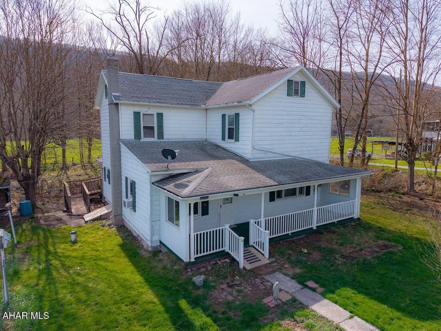 Charming two-story country home full of potential, set against a backdrop of scenic mountain views and open pastures. This 3-4 bedroom, 1-bath property features classic wood floors and high ceilings that add character and warmth throughout. A peaceful stream runs along the property, creating a serene, nature-filled setting. Enjoy quiet mornings or relaxing evenings on the large front porch. The detached two-car garage includes electric, offering great space for storage or a workshop. This home does need TLC , with a little vision and care, it could truly shine as a beautiful rural retreat!!