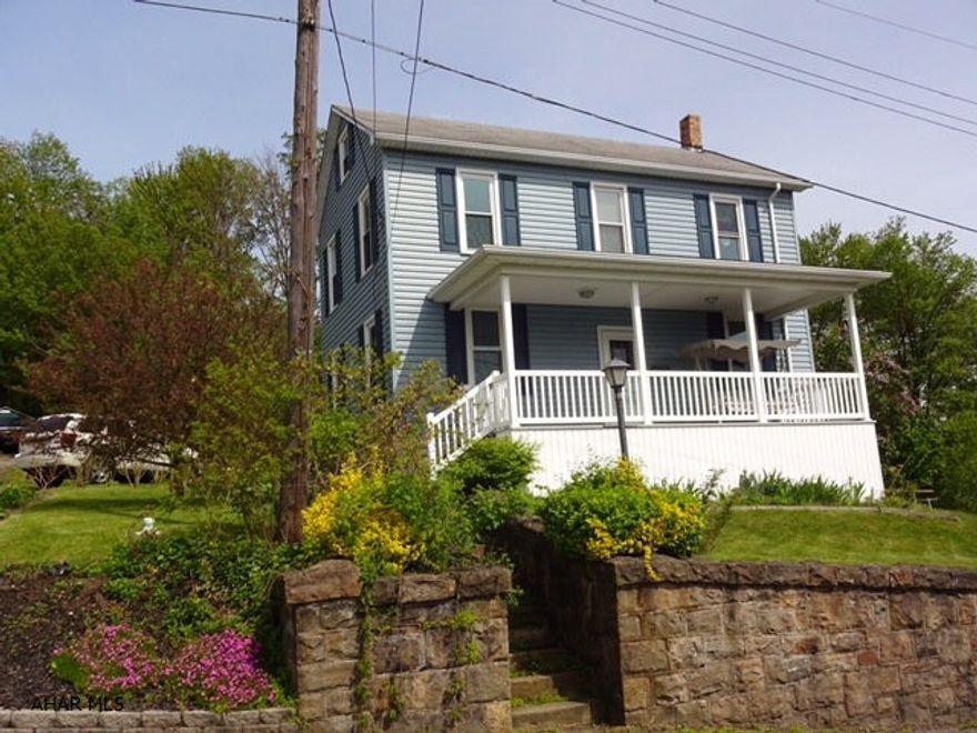 Exterior has newer vinyl siding & windows. Kitchen & LR are nice big, spacious rooms. 4 Bedrooms. Laundry ion the 1st floor. Great, private & big back yard.