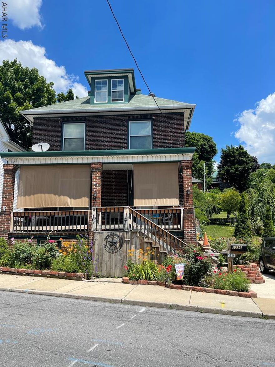 REDUCED!  Very spacious and beautifully renovated brick home in Altoona and is situated on a very large lot!!  THREE different parcels.  As soon as you enter the home, you will notice the Tile flooring in the Foyer -   then you will notice the kitchen - that is open to the living/dining room that feature beautiful original woodwork.  There is a newer 1/2 bath situated just off the kitchen as well, for convenience.  Upstairs you will find 4 bedrooms - new drywall in most of the bedrooms (one bedrooms is small)  There is also a newer bathroom on this floor.  There could be another bedroom in the third floor, if needed.  Newer Thermopane windows throughout.  There is  a large covered front porch.  Don't worry about parking --- there's plenty of that out back and on the side of the property. PENDING SOON - JUST WAITING FOR FINAL INITIAL