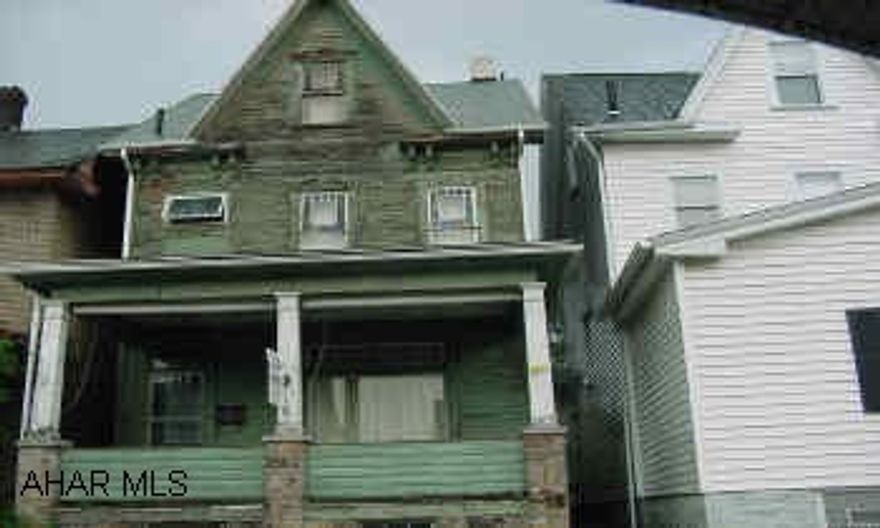 2.5 STORY HOME WITH NEWER ROOF IN NEED OF UPDATES AND REPAIR.  "AS IS". 2.5 STORY HOME WITH NEWER ROOF NEEDING UPDATES AND REPAIR.  "AS IS" SALE.  OFF STREET PARKING.  MAY HAVE VALUE IN THE "STAINED-GLASS TYPE" WINDOWS.  APPLIANCES.  POTENTIAL GALORE!  CALL MIKE MANGIA 941-3997 OR X121.