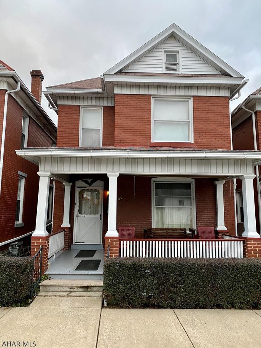 Don't miss out on this solid Brick home with a welcoming front porch. It is centrally located in the borough of Huntingdon close to schools, hospital and shopping. The original woodwork thoughout will wow you. The first floor has an addition that can be a rec room, bedroom, den, or gathering room. Enjoy the convenience of a 3/4 bath and laundry area on the main level. The upstairs boasts 3 spacious bedrooms, full bath, and an area for an office or a sewing/reading room that leads to the walk-up attic. There are hardwood floors throughout under the carpeting that could be refinished. A little TLC can take this home to a new level and be a beautiful place you can call home.
