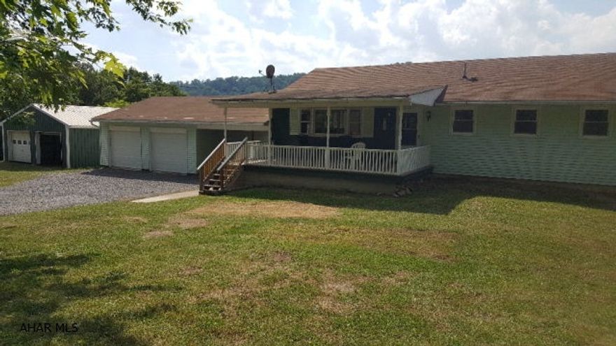 If you are looking for single floor living, then this 3 bedroom ranch with original hardwood floors throughout may be the home for you!  Recent updates have been completed on the rear deck, front porch and bathroom.  Also, new thermo pane windows have been recently added. Located in a private, peaceful and secluded setting, this property is situated on 1.38 acres of ground.  The yard is fenced in, and the surrounding land contains pear, cherry and apple trees, as well as grape vines and plenty of room for a garden or swimming pool.  Attached is a car port and 2 car garage, as well as a 2 car pole garage.  This is perfect space for a workshop, vehicles, ATV's, or just your extra stuff.  This home is located in the Hollidaysburg School District, with Frankstown as the assigned elementary.