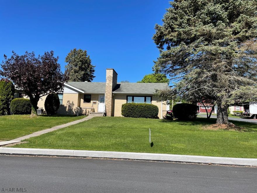 f you are looking for a spacious 4 bedroom 3.5 bath brick ranch house sitting on a flat corner lot in Ebensburg Borough, this is the one for you!  The eat in kitchen has plenty of cabinets and counters for meal prep, it leads right into the spacious living room that features large picture windows and wood burning fireplace.  Off of the wide hallway there are 3 bedrooms and a full bath, all bedrooms have nice sized closets, at the end of the hallway is the large master suite with large 3/4 bath.  There are two bonus rooms on the main level that can be used as additional family living space/office space/home gym. Laundry hookups are in the back room that has a half bath. Basement also has a family room and 3/4 bath. 2 car garage and an outbuilding with electric.  So much to see, call today!