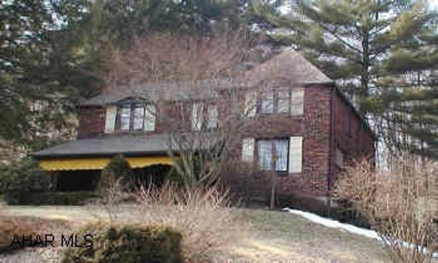 Stately brick home on large hillside lot.  Separate 2 car garage and shed.  Large living room with gas fireplace, formal dining room, cherry kitchen with Jenn air range, refrigerator, dishwasher, disposal, double oven.  New roof. Stately 3 bedroom brick home, 2 car garage  1/2 acre lot.  New roof.  Beautiful cherry kitchen with all appliances.