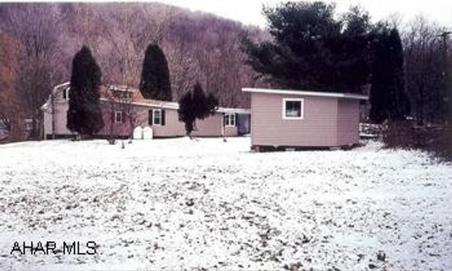 2 story vinyl sided home or cabin located along chest creek on River Road.  2 beautiful secluded acres.  Great location for a camp or home with a stocked trout stream in the front yard,access to local amenities,within minutes of state game lands&Rock Run. Property is being sold in "as is" condition.  Property has a holding tank for the sewage.