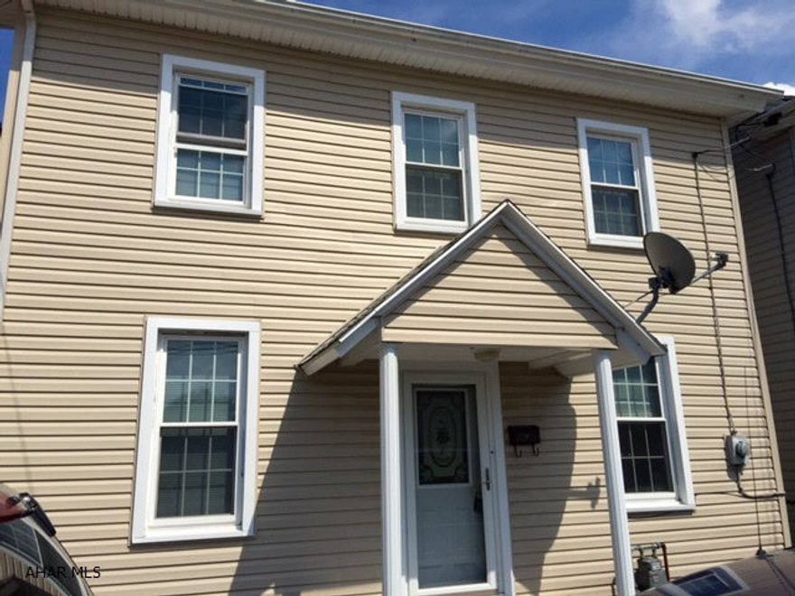 This is a great starter home or rental investment. Remodeled kitchen with oak cabinetry, new flooring, stove and refrigerator included. Bath has been remodeled. First floor has new electric wiring, new insulation, new vinyl siding, has been installed, thermo windows for more energy efficient and lower utility bills. Covered porch in back overlooks semi private fenced in back yard. Ready to move in.